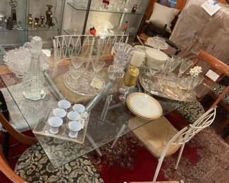 Glass top rectangular dining table with abstract chrome legs (30” x 71” x 39”) $625 + tax