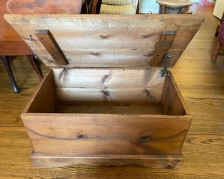 #24 Wood chest carved front with/brass handles and interior latch - as is finish 30x17x15" $ 40.00