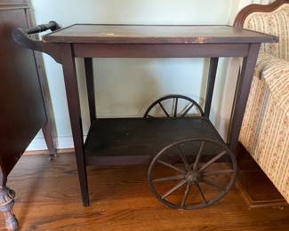 #10 Antique wood wheeled tea/bar cart. 2 Shelves. As is finish. 31.5x27.5x17.5" $ 50.00