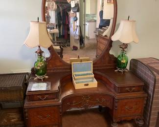 #41 5 Drawer wood carved vanity with veneer drawer fronts. 8 legs on casters. Matching mirror. As is finish 49.5x21x72" $ 175.00