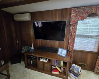TV with sound bar and console table