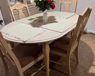 Light Wood Dining Set with Oval Table and Four Chairs