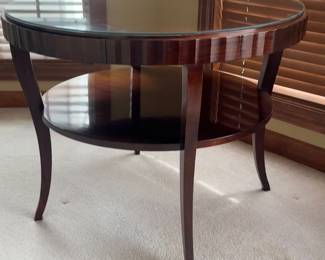 A gorgeously designed fluted-edge, two-tiered entry table by Barbara Barry for Baker. This timeless tables has a hand-planed, mahogany top, rich mahogany finish, lower shelf and a single pull-out drawer discreetly tucked along its fluted edge. This well-proportioned utility player can be used seamless as an entry, side or hall table. Glass top is removable. Will look amazing with a big vase of flowers in an entry way! Circa 1990s Product Information� Materials: Mahogany Dimensions: 38" W x 38” D x 30.5” H Style: Traditional, Transitional, Contemporary Condition: Excellent. Minor surface wear. $600