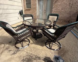 Patio set with 4 swivel chairs, glass top table and umbrella stand