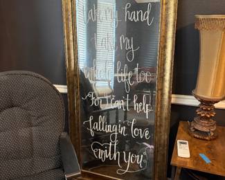 large standing gold framed mirror