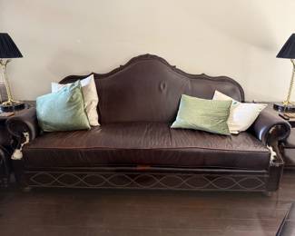 leather couch with wood and cowhide trim