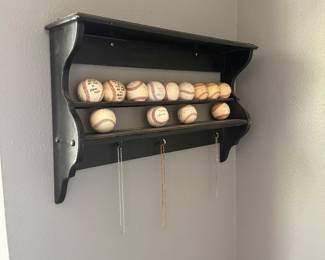 floating shelf with baseballs