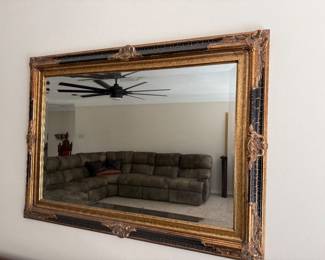 black and gold framed mirror