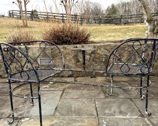 Antique wrought iron tête-à-tête (also known as a "kissing bench" or "gossip bench")