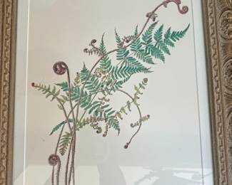 Framed piece appears to be a botanical watercolor painting of unfurling ferns by the artist Lara Call Gastinger.  The Barn Swallow The Barn Swallow  +1 Gastinger is a highly regarded botanical illustrator from Virginia who was the chief illustrator for the Flora of Virginia. Her work is known for its intricate scientific detail and focus on the natural lifecycle of plants.