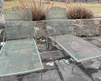 Vintage wrought iron rolling chaise lounges