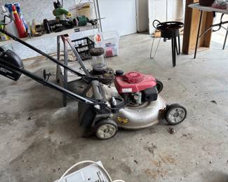 Working lawnmower, ready to cut grass