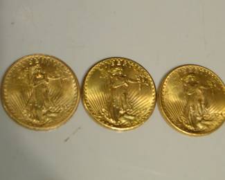 Reverse side of the gold coins. NOT ON PREMISE before Friday!