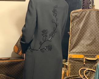 Gianni Versace Couture wool coat, featuring extensive black beading and sequin embroidery.