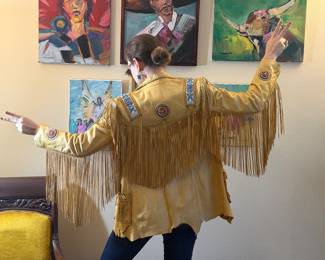 Gorgeous Ren Ellis designs for North Beach Leather. Leather fringe jacket with beaded accents.