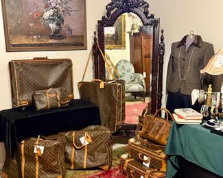 Vintage and modern Louis Vuitton luggage, totes, handbags.