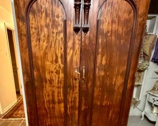 Figured mahogany wardrobe.