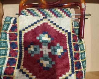 Tortoise shell handles on a crafted purse