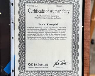 This lot features a professionally framed signed letter of composer, Erich Korngold on a personal letterhead circa 1954. The frame has some damage and cracks in the glass as shown in photos. Accompanied with a certificate of authenticity. Measures in frame, 26” H x 12” W.