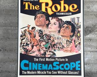 This lot features an original movie poster from The Robe circa 1953. This lithograph movie poster is limited edition, numbered 53/440. Measures in frame, 41” H x 27” W.
