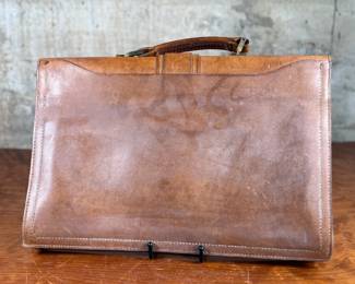 Proceeds from this lot will be donated to non-profit Salem Dogs in Marion County, Oregon. This lot features an antique leather briefcase manufactured by Renwick out of Canada. Salem Dogs focus is on helping special needs dogs when their people experience extreme circumstances. Owner death, hospice, and nursing/assisted living situations are some examples that trigger the need for a new home. In addition, some people find themselves unable to afford medical bills and opt to have their dog euthanized. In those cases, Salem Dogs is often contacted and has either taken in the dog or helped the owner financially. While most of their work is in the Salem, Oregon area, this charity has helped dogs in multiple areas around North America.