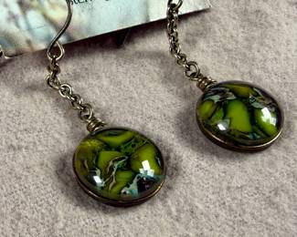 This lot features a pair of sterling silver earrings by designer, Heather Bivens of “Weathered Heather”.