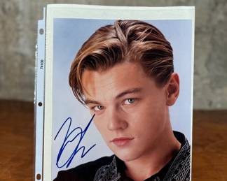 This lot features a signed photograph by actor Leonardo DiCaprio and comes with a certificate of authenticity.