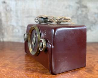 This lot features a vintage Crosley bakelite radio, specifically a "dashboard" model circa 1950s. Comes untested.