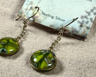 This lot features a pair of sterling silver earrings by designer, Heather Bivens of “Weathered Heather”.