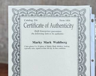 This lot features a signed photograph of actor Mark Wahlberg, also known as “Marky Mark”. Comes with a certificate of authenticity.