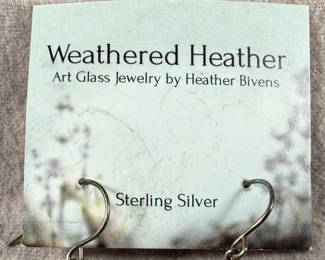 This lot features a pair of sterling silver earrings by designer, Heather Bivens of “Weathered Heather”.