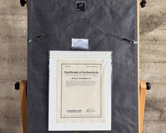 This lot features a professionally framed signed cachet by Russian Composer, Dmitry Shostakovich. Accompanied with a certificate of authenticity. Measures in frame, 25.5” H x 19.75” W.