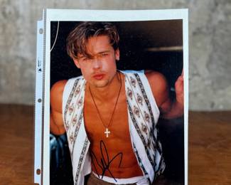 This lot features a signed photograph of actor Brad Pitt and comes with a certificate of authenticity.