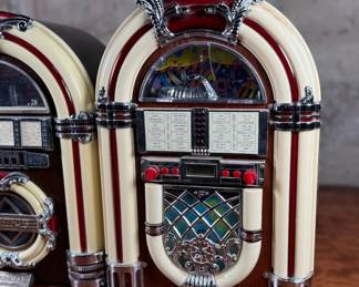This lot features a pair of jukebox-style radios, likely considered vintage now! They measure, 15” H and come untested.