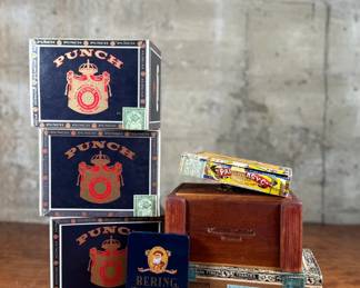 This lot features a curated collection of vintage cigar boxes in various conditions.