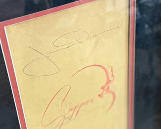 This lot features a professionally framed photo of James Dean along with a signed menu from the Terrace Grill. Accompanied with a certificate of authenticity. Measures in frame, 19” H x 23.5” W.