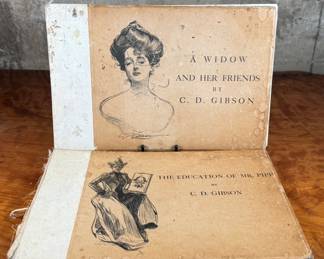 This lot features a pair of antique illustrated books featuring drawings by Charles Dana Gibson. A Widow and Her Friends is a hardcover book published around 1901, featuring the iconic Gibson Girl illustrations. The Education of Mr. Pipp is another collection of Gibson’s works, often bound similarly in large folio formats. 