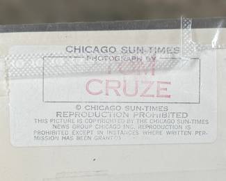 This lot features a vintage photograph of Wayne Gretzky held in a protective sleeve, along with a limited edition commemorative pin set.