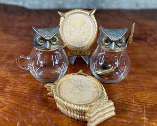 This lot features a vintage owl themed set with two jars manufactured by Ted Arnold Ltd., and a set of four (4) "owl" coasters.