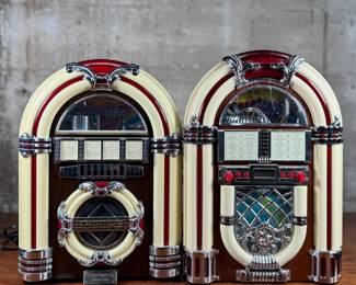 This lot features a pair of jukebox-style radios, likely considered vintage now! They measure, 15” H and come untested.
