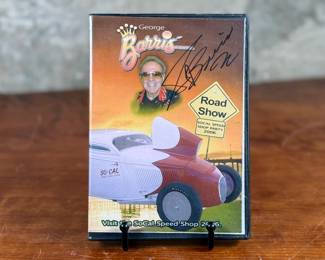 This lot features a rare signed copy of “Road Show” by George Burris. Accompanied with a certificate of authenticity.