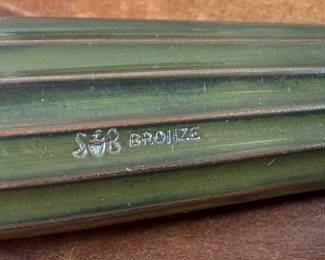 This lot features an antique bronze vanity set with two of the items marked by manufacturer S & B Saart Brothers out of Attelboro, Mass.