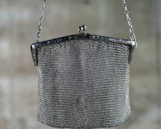 This lot features a pair of antique German silver mesh flapper purses from the late 19th century in good condition. One is marked, "German Silver" as shown in photos.