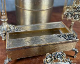 This lot features a curated collection of vintage Hollywood Regency-style bathroom accessories including a soap tray, a tissue holder, waste basket, and more.