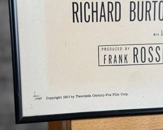 This lot features an original movie poster from The Robe circa 1953. This lithograph movie poster is limited edition, numbered 53/440. Measures in frame, 41” H x 27” W.