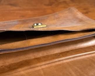 Proceeds from this lot will be donated to non-profit Salem Dogs in Marion County, Oregon. This lot features an antique leather briefcase manufactured by Renwick out of Canada. Salem Dogs focus is on helping special needs dogs when their people experience extreme circumstances. Owner death, hospice, and nursing/assisted living situations are some examples that trigger the need for a new home. In addition, some people find themselves unable to afford medical bills and opt to have their dog euthanized. In those cases, Salem Dogs is often contacted and has either taken in the dog or helped the owner financially. While most of their work is in the Salem, Oregon area, this charity has helped dogs in multiple areas around North America.