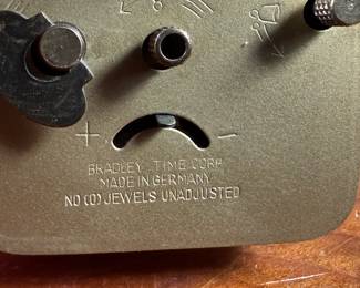 This lot features a vintage Bradley mechanical travel alarm clock, manufactured in Germany and is in good working condition.