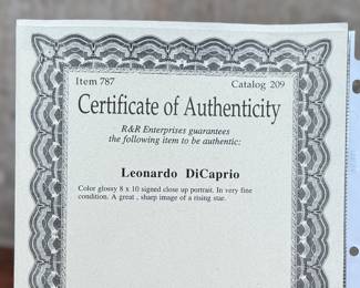 This lot features a signed photograph by actor Leonardo DiCaprio and comes with a certificate of authenticity.