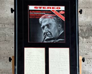 This lot features a professionally framed two-sided letter signed by composer, Ralph Vaughan Williams along with a LP by composer Sir John Barbirolli. Measures in frame, 31” H x 21.5” W.