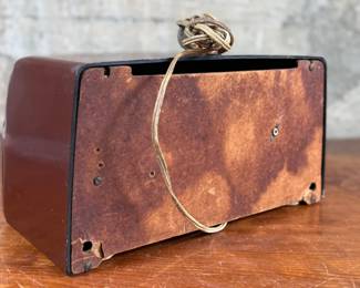 This lot features a vintage Crosley bakelite radio, specifically a "dashboard" model circa 1950s. Comes untested.